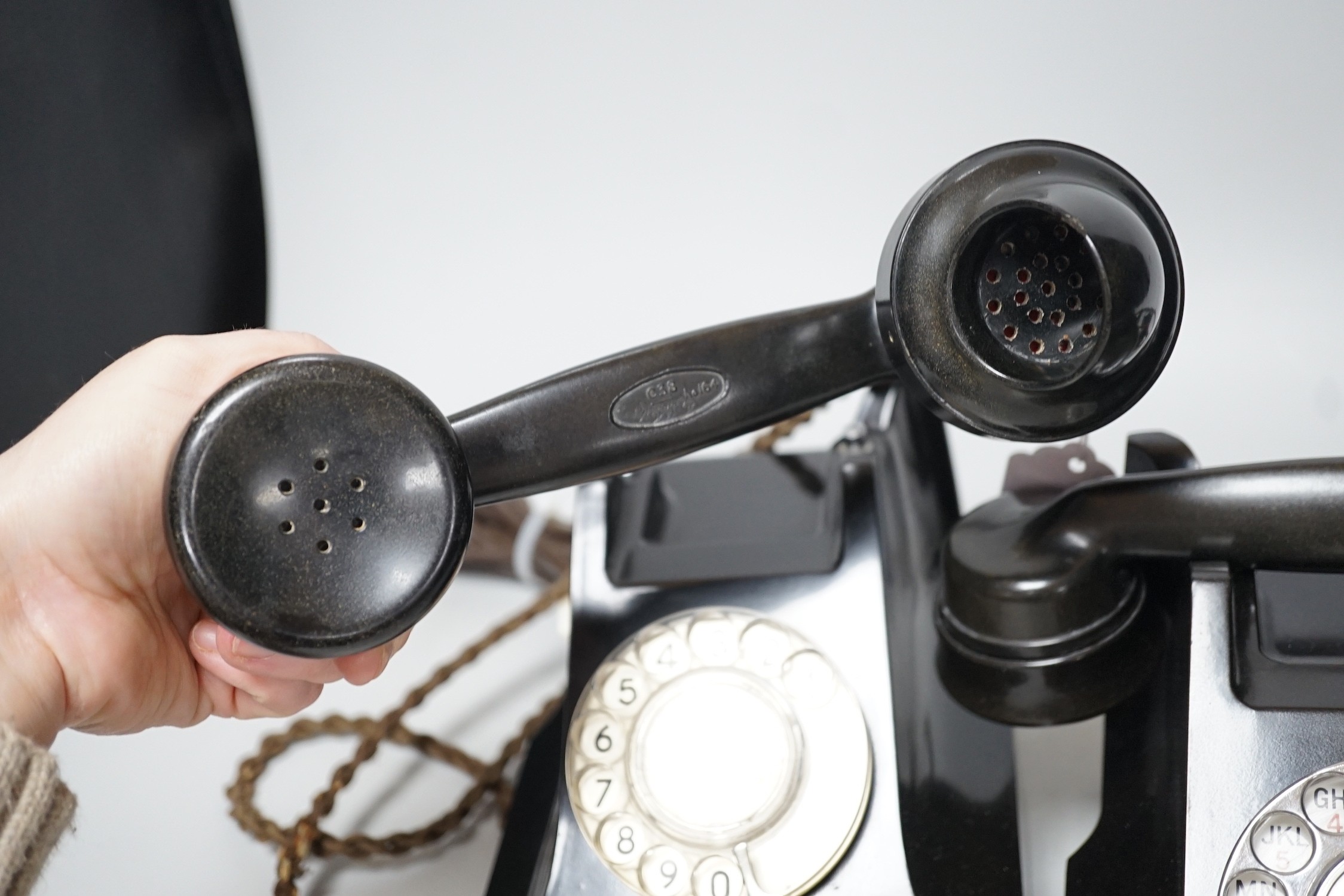 Two black Bakelite telephones with drawers